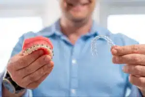 Adult patient comparing braces and Invisalign treatment options