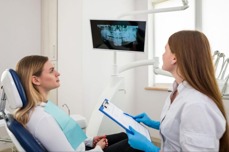 Orthodontist explaining adult orthodontic treatment with digital smile planning