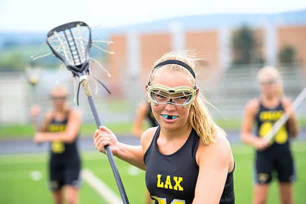Teen with mouthguard on braces during sporting activities